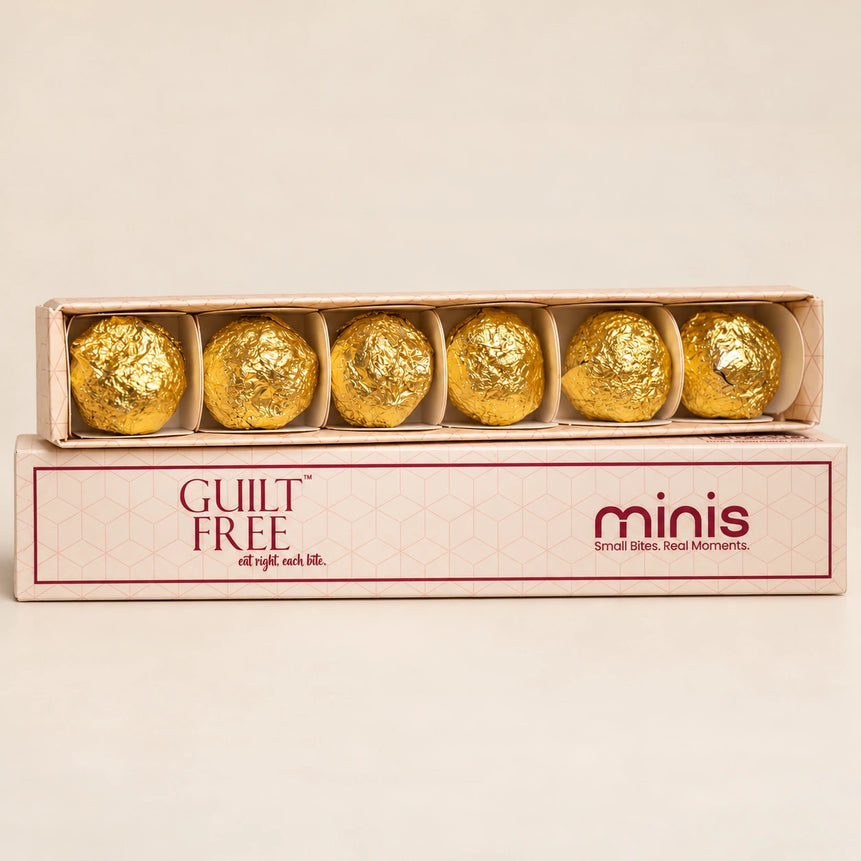 Guilt Free Minis slider box displaying six individually gold-wrapped Date Bites and OG Bites.