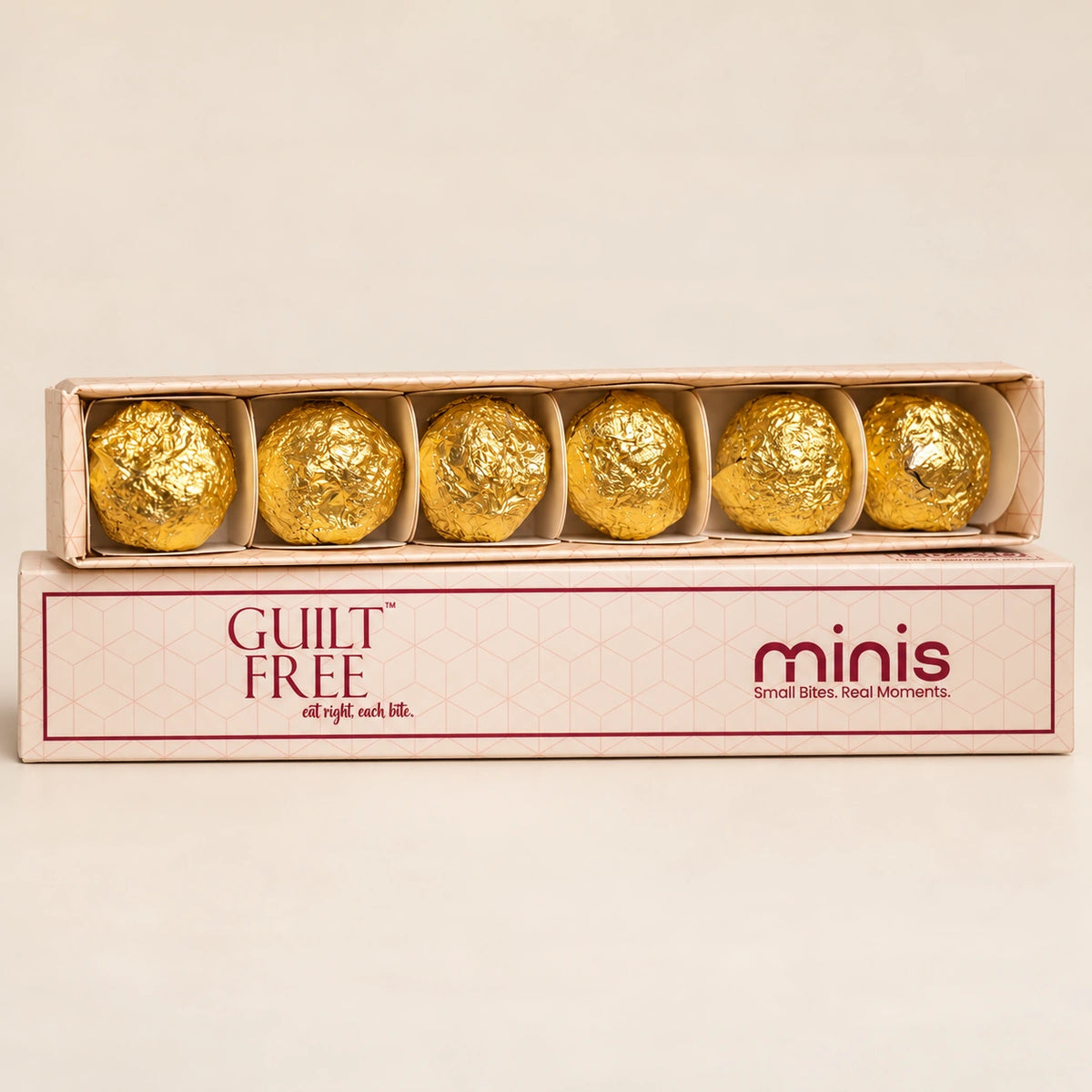 Guilt Free Minis slider box displaying six individually gold-wrapped Date Bites and OG Bites.