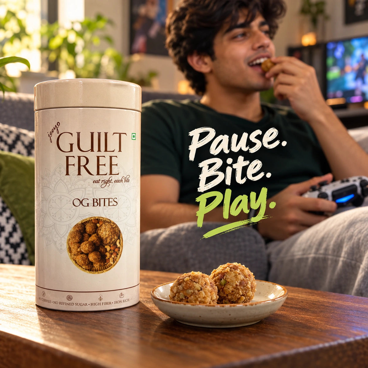 Guilt Free OG Bites tin and gond laddus during a gaming break at home.