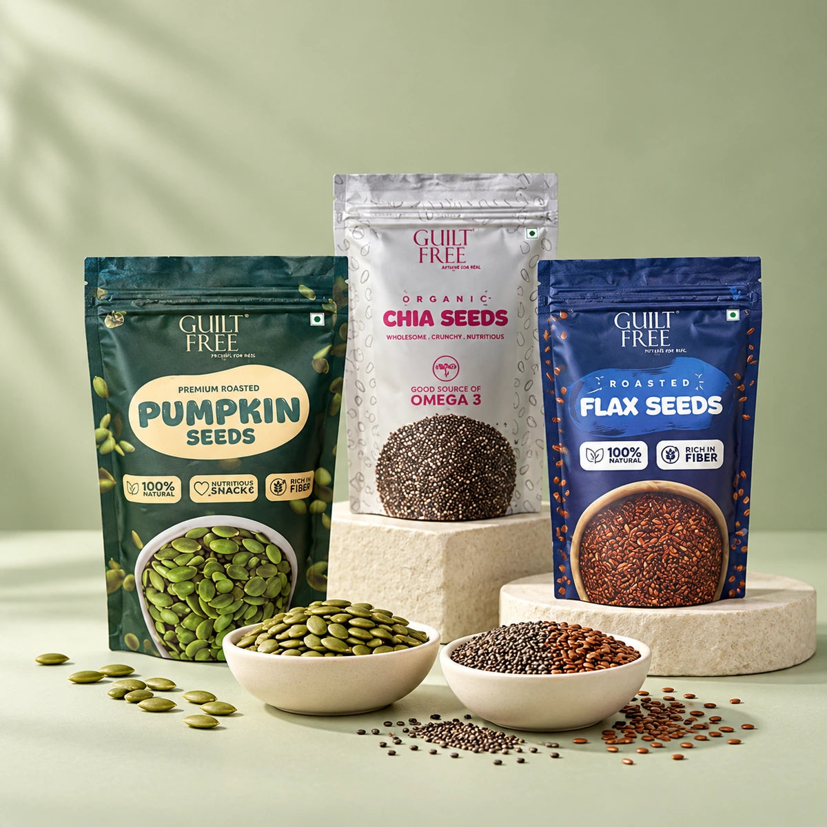 Guilt Free pumpkin chia and flax seed pouches with bowls of seeds