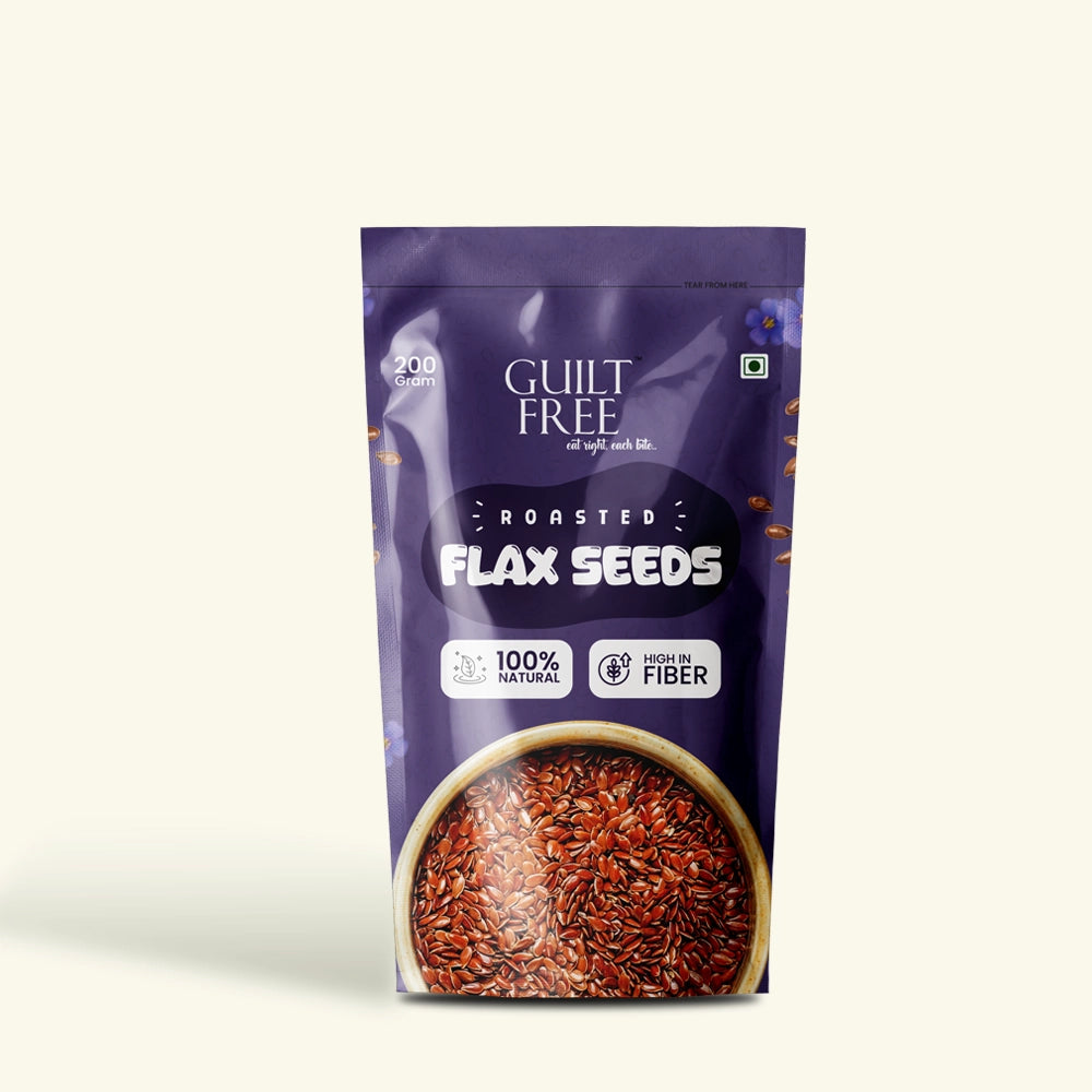 Purple package of roasted flax seeds with visible text and a bowl of seeds on a white background